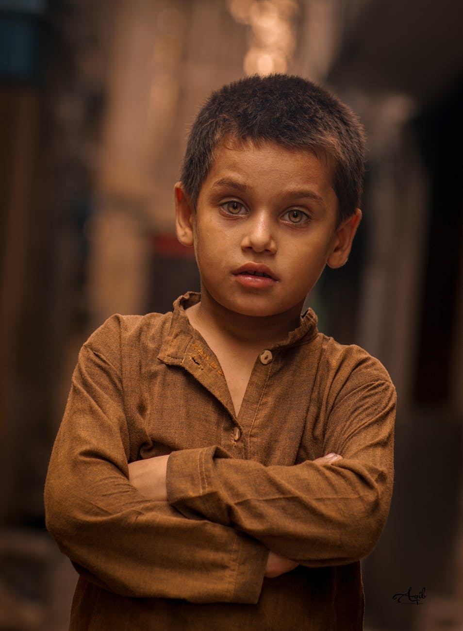 photo of boy wearing brown long sleeves